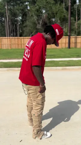 A post by @iamdwoodsx on TikTok caption: Shirts available online now. Available in 4 colors: red, pink, black,& orange 🔥 IG: galleriasecrets 