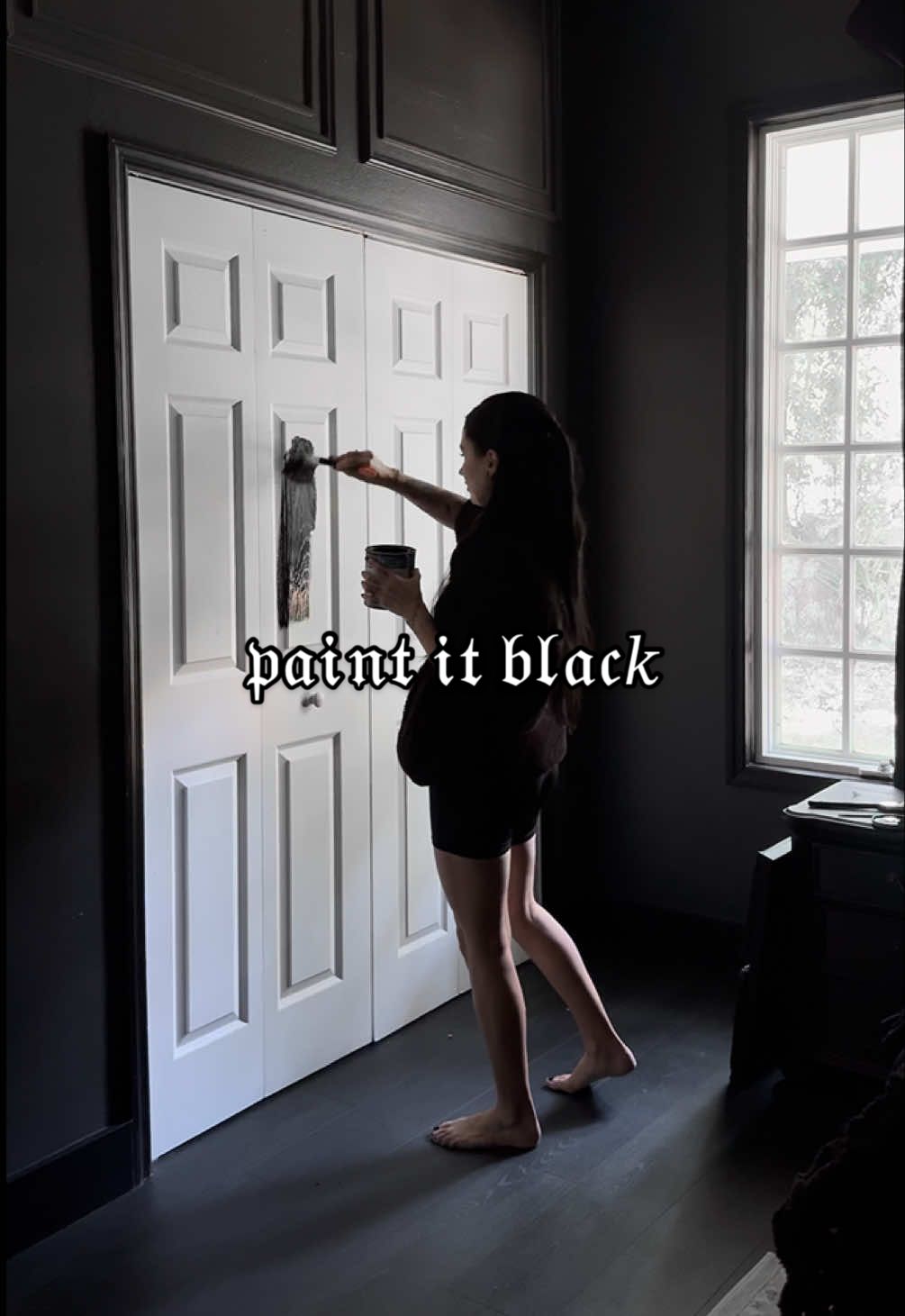 A post by @evdreadful on TikTok caption: legend has is, she’s still painting all the doors 𝔟𝔩𝔞𝔠𝑘 💀🖤 #homedecor #gothhome #paint #aesthetic #allblack #DIY #alt #spooky #gothinterior 