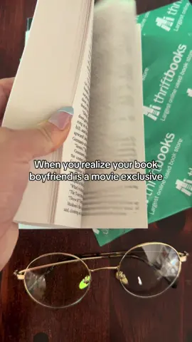 A post by @thriftbooks on TikTok caption: Lots of dinosaurs, not a lot of Jonathan Bailey in tiny glasses. 🥲🦕🦖 #thriftbooks #readersgonnaread #readerlife #BookTok #jurassicpark #bookhumor #readerproblems #jonathanbailey