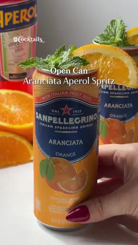 A post by @cocktails on TikTok caption: San Pellegrino Aranciata meets Aperol for the ultimate citrusy spritz 🍊✨ Ingredients (per cocktail): -1 can San Pellegrino Aranciata -2 oz. Aperol -1.5 oz. orange juice -3.5 oz. prosecco -San Pellegrino Aranciata for topping off #aranciata #aperolspritz #aperol #spritz #opencancocktails #orange