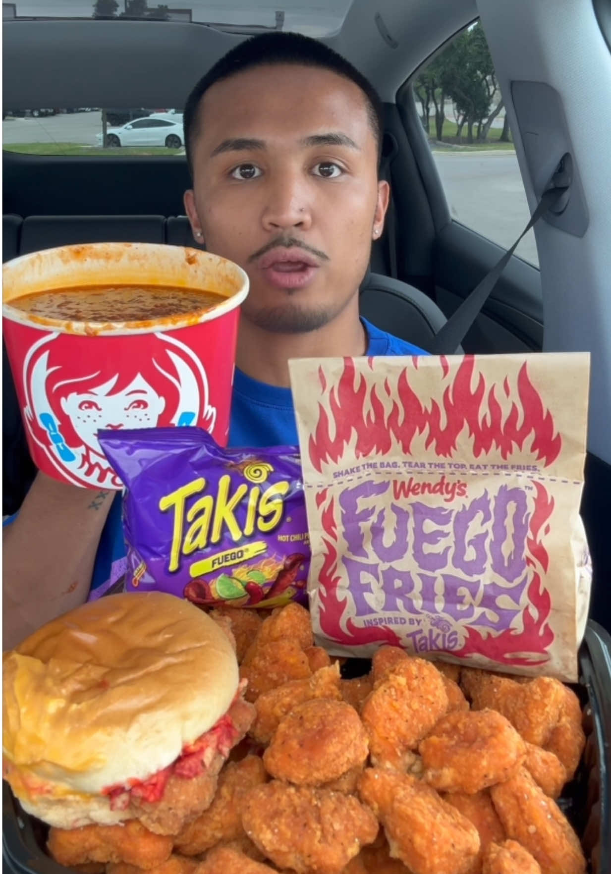 A post by @lifeofcian on TikTok caption: Wendy’s Tesla😂 (this is AI) #fyp #fastfood #foodie #fypシ #foodtiktok #mukbang #wendys #foodasmr #tastetest #foodreview 