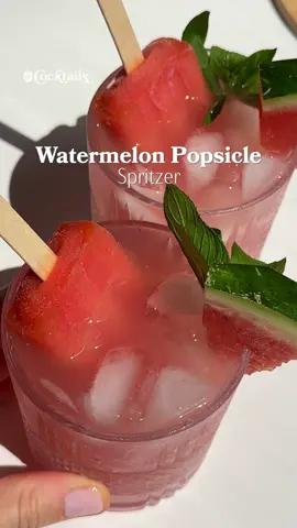 A post by @cocktails on TikTok caption: Sipping on summer with a watermelon popsicle spritzer. 🍉🫧 Ingredients (for 1): - 1 & 1/2 oz. vodka - 1 oz. fresh watermelon juice - 1/2 oz. lime juice - club soda - watermelon popsicle - watermelon and mint for garnish #watermelon #popsicle #spritz #spritzer #cocktail #summer #inspo #drink