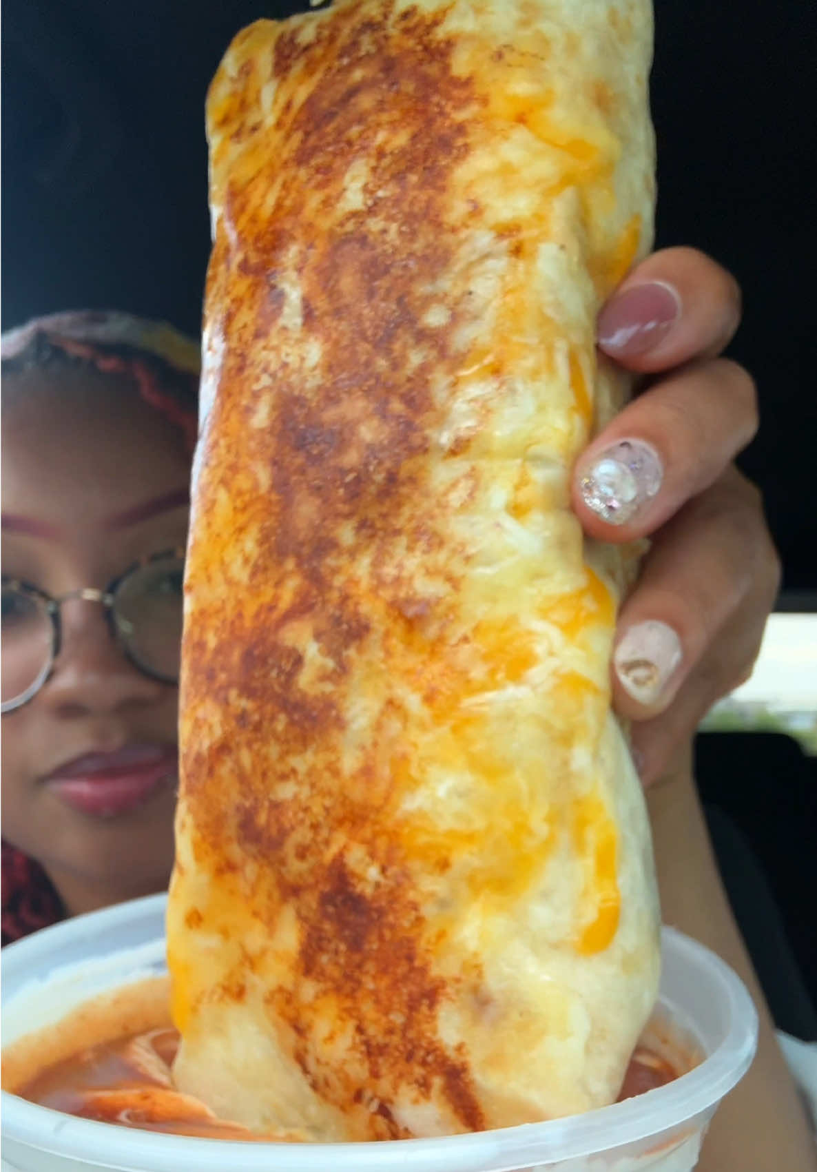 A post by @kie_eats on TikTok caption: @tacobell Grilled Cheese Steak Burrito 🌯 Nacho Fries 🧀 I Also Got Their Chicken Nuggets 🍗 #tacobellmukbang #tacobell #grilledcheeseburrito #burrito #mukbang #fyp #fypシ Taco Bell Mukbangs