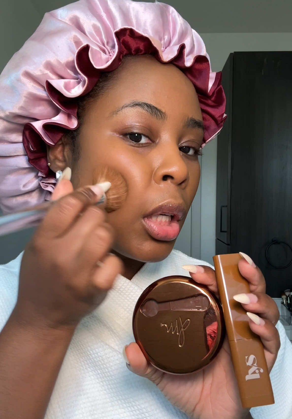 A post by @ on TikTok caption: Just layered @DanessaMyricksBeauty yummy skin blurring balm with the @LYS Beauty triple fix foundation stick and the finish is out of this world. Lightweight. Skin like. Blurred. This combo gave me the most natural, soft focus complexion ever!  This is what happens when two visionary black women create Makeup for real skin. The blendability, the undertones, it just makes sense. 