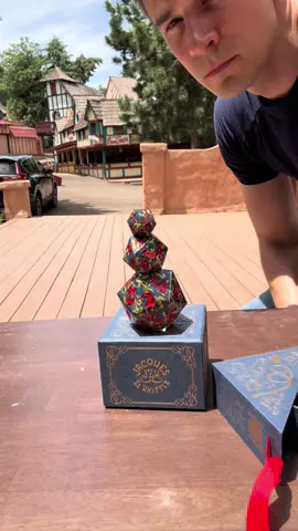 A post by @jacqueszewhipper on TikTok caption: New dice? Who dis?  We’ve got all sorts of cool stuff as part of a partnership with @Emberglow Gaming and the presale’s JUST getting underway now!  Link in my linktree, and get on this soon before the pre-sale ends!  #renfaire #dnd #jacqueszewhipper #circus #renfest