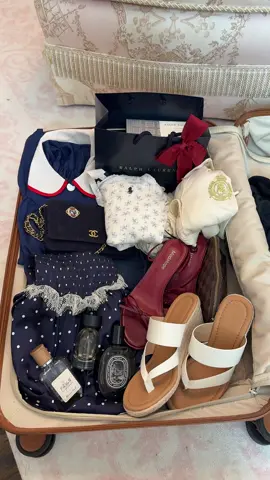 A post by @fancytiktokbygab on TikTok caption: when my suitcase layout is cuter than me lol #travel #suitcase #fyp #fourthofjuly 🌊 🇺🇸 
