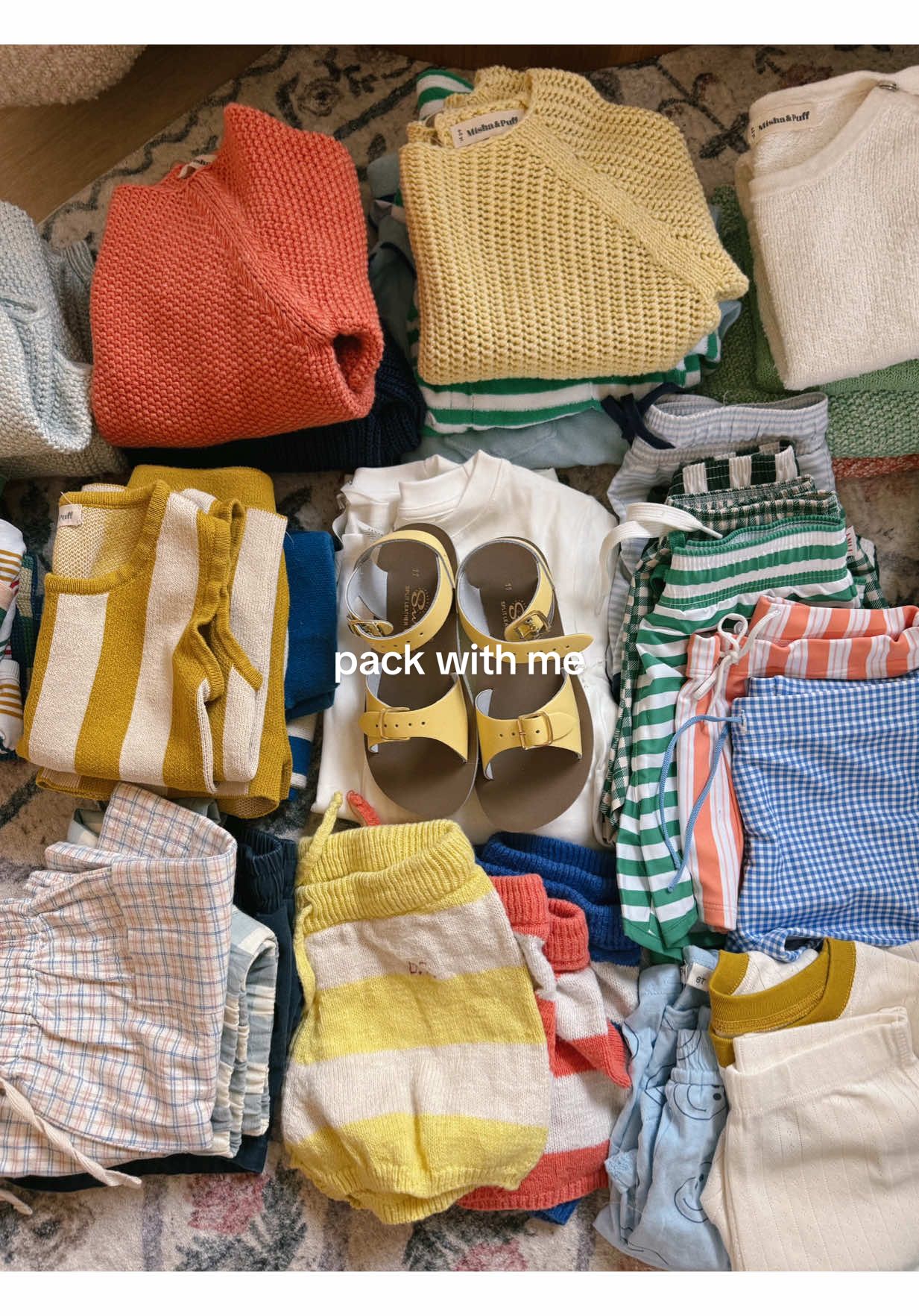 A post by @emilyfranciswheaton on TikTok caption: these babies are going to Portugal!! with a pit stop in PA & Maine 🤪  #packwithme #packing #traveltok #travellingwithkids #portugalwithkids @away @minnow @saltwatersandals @Spilled Milk @Konges Slojd 