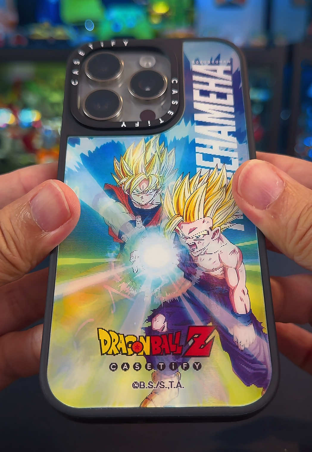 A post by @geekculture on TikTok caption: Celebrating the 40th Anniversary of Dragon Ball with these Dragon Ball Z X CASETiFY accessories for iPhone and AirPods. The Goku & Gohan “Kamehameha” Lenticular Case is our favourite! #DragonBall #DragonBallZ #CASETiFY #SonGoku #Kamehameha #iPhone #AirPods #WhatToBuy #Geek #Anime #fyp #fypシ 