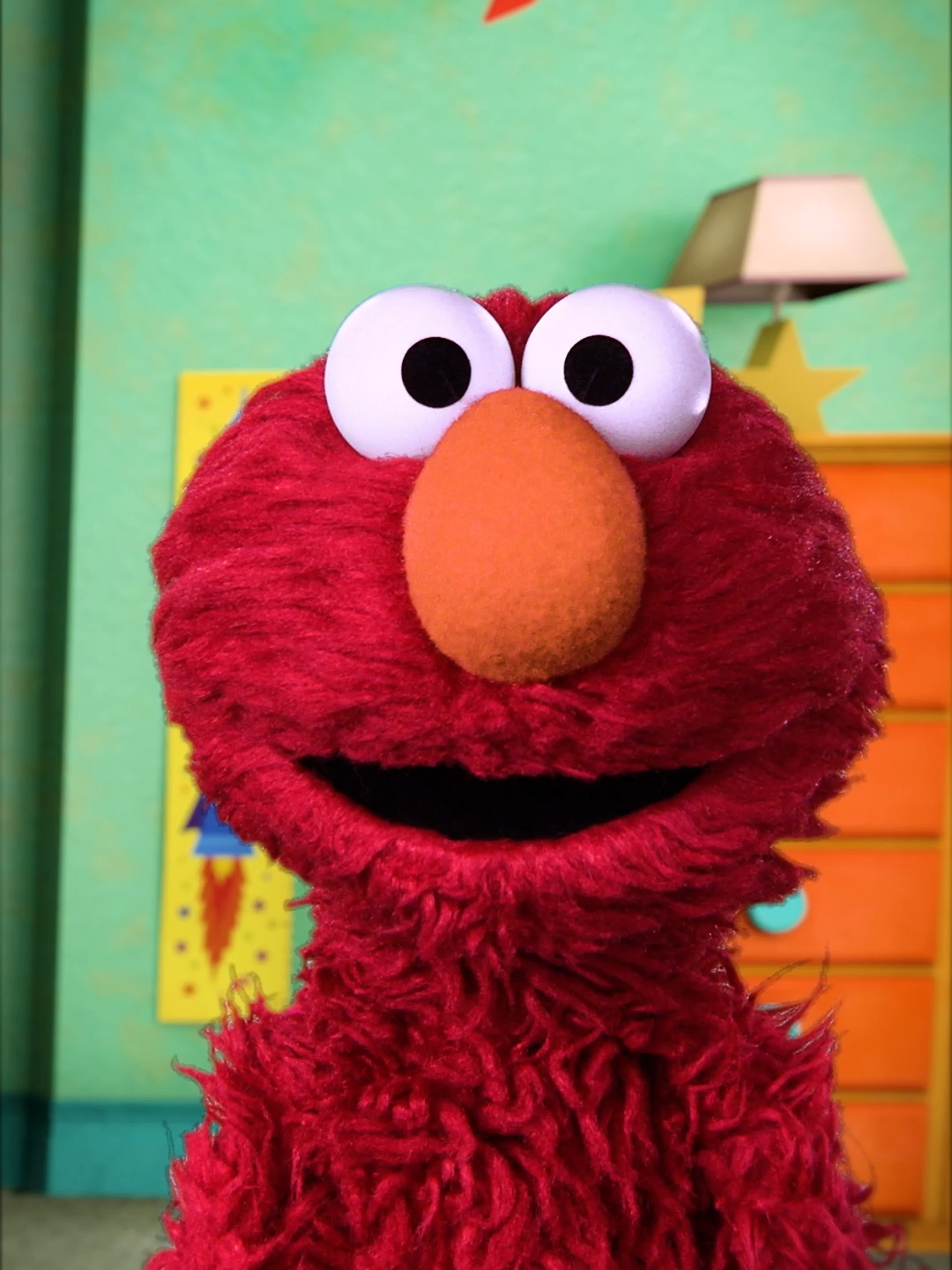 A post by @sesamestreet on TikTok caption: Fit-check time. Elmo's OOTD is.... Red!