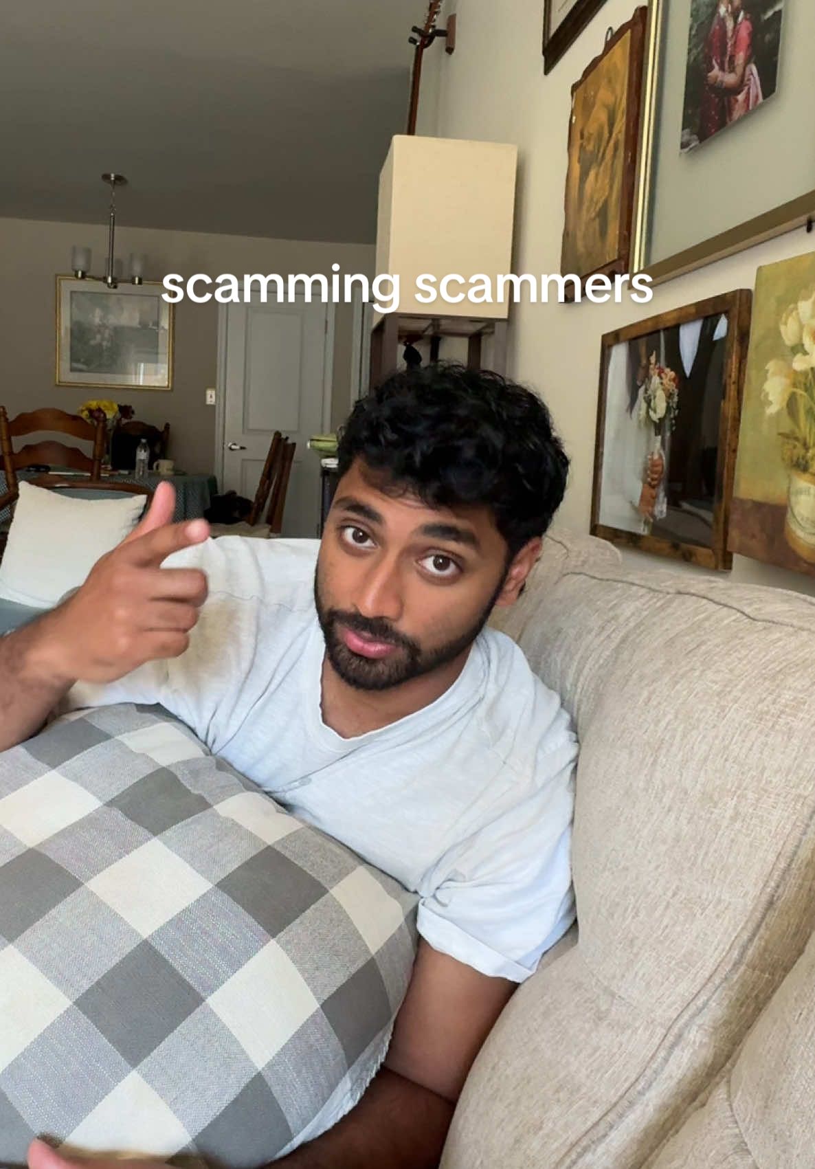 A post by @mattandkharli on TikTok caption: he is a scammers worst nightmare 😂 #mattandkharli #couplestiktok #husbandwife #cutecouple #funny 