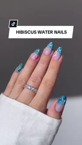 A post by @revolve on TikTok caption: These nails from @Aistė Haas are giving tropical oasis, and we're loving it!! Manifesting a getaway to match this mani 💅🌺🌊 #revolve #revolvebeauty #nailtutorial #nailart #nailinspo #manicure #acrylicnails #gelx #foryou #fyp