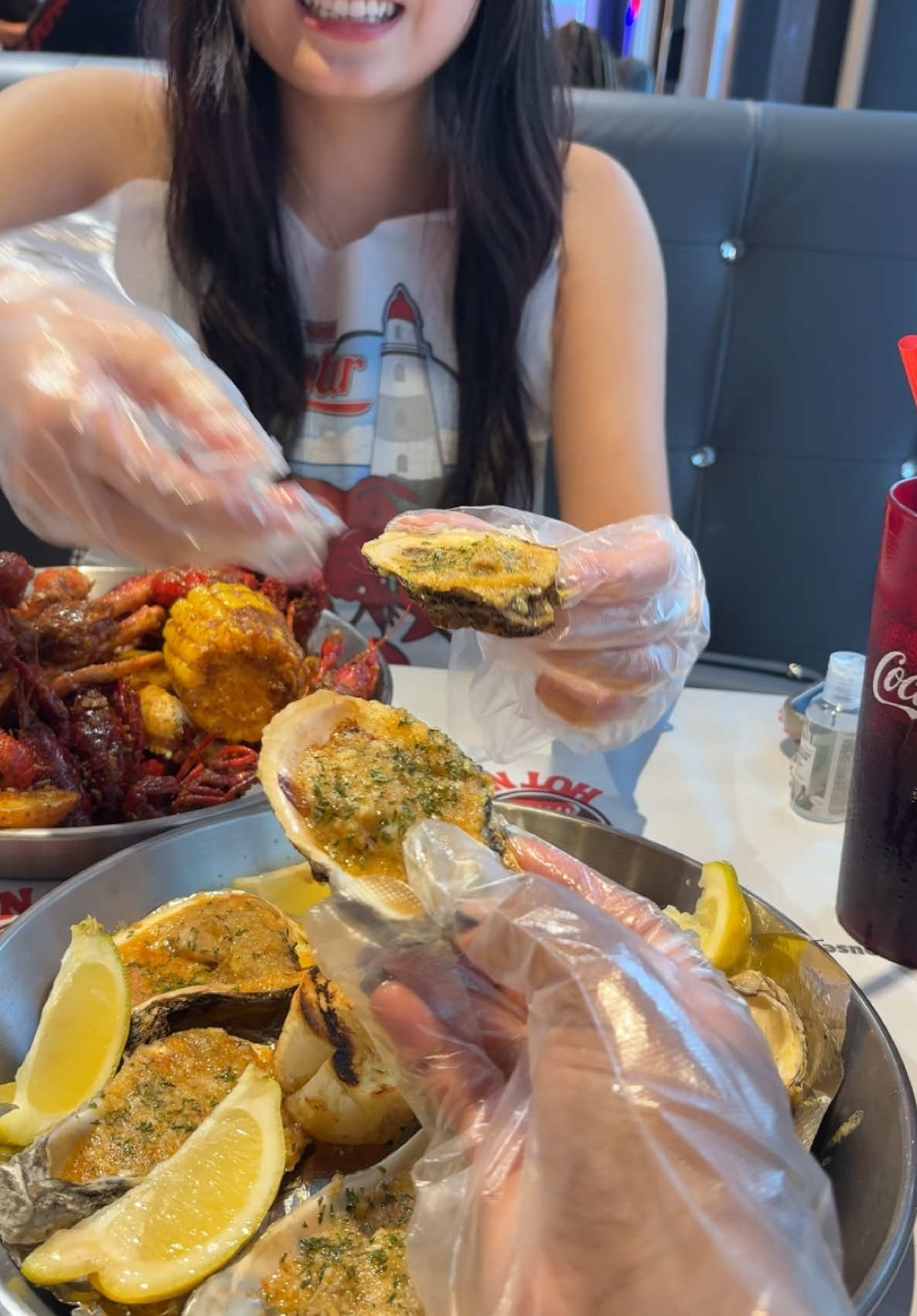 A post by @aiyannace on TikTok caption: New Orleans has the best seafood I fear😩 🦞 #neworleans #crawfishboil #vaseline #chargrilledoysters 