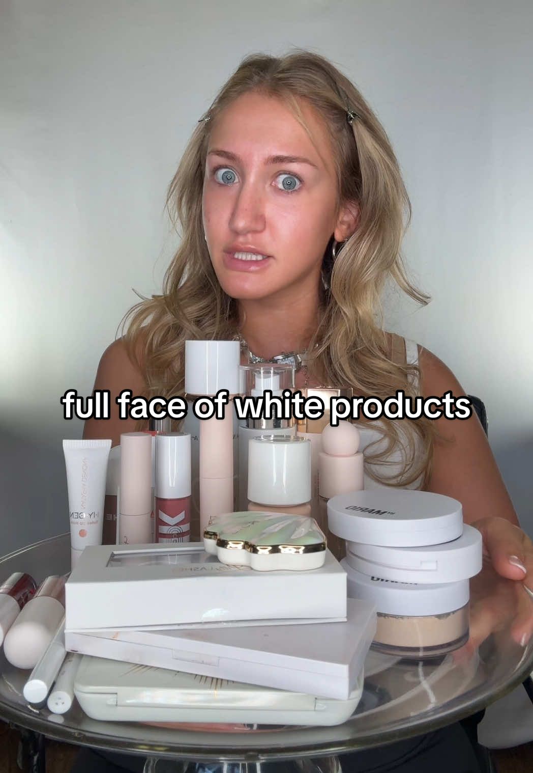 A post by @katiefarhood on TikTok caption: Replying to @mogene🎊 PT.1 of doing a full face of makeup ONLY with white packaging 🤍🐇🦢 #makeupchallenge #beautychallenge #makeupcollection #MakeUpArtist #makeupcollector 
