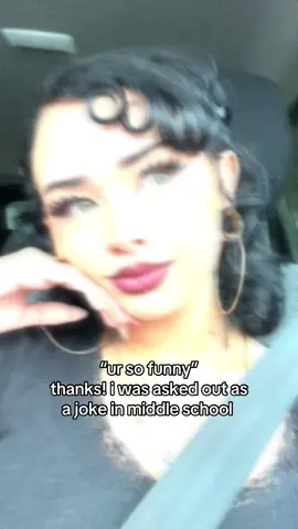 A post by @chiquitaolguita on TikTok caption: if u can’t handle me at my xD u can’t have me at my 🦇💅🏻 #alternative #gothsummer #curlyhair #wlw #tattoos #piercings #lgbtq 