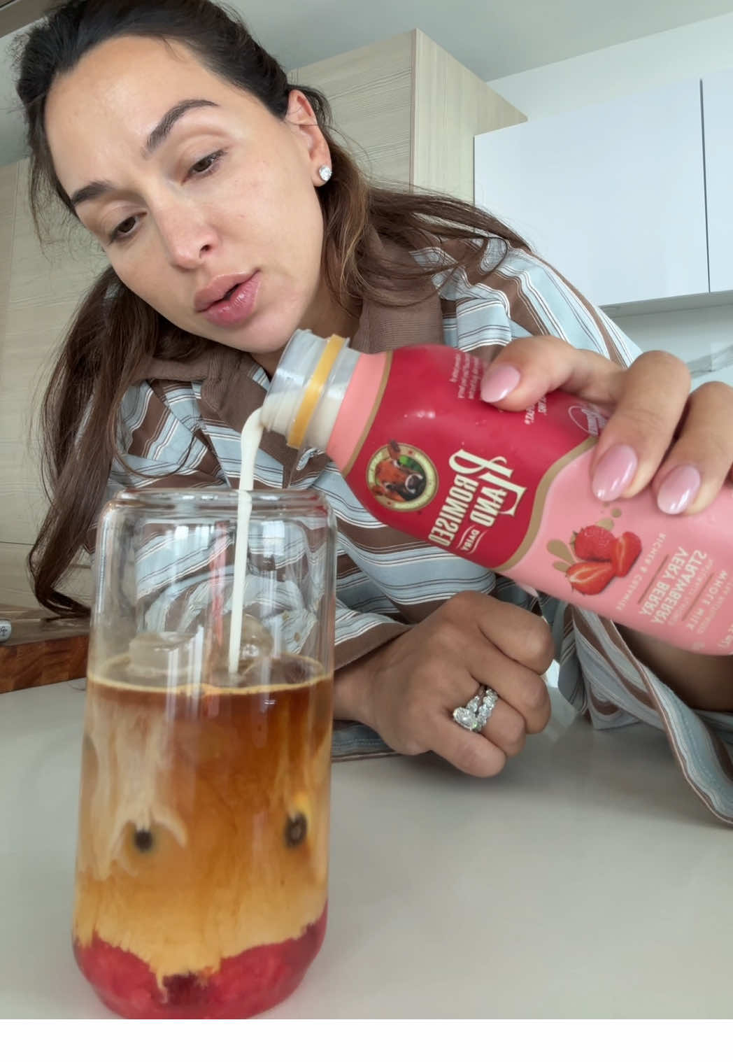 A post by @dzaslavsky on TikTok caption: Made myself a midday sweet treat / pick me up - a strawberry ice coffee and it was perfect ☕️🍓 #icecoffee #strawberry #strawberrylatte 