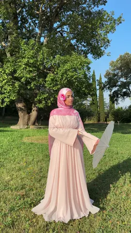 A post by @byhasanat on TikTok caption: Pink moments🌸🎀 The ‘Amirah’ chiffon dress is launching 14st July at 12pm BST 💌  #modestfashion #hijab #modest #modestdress #nikkahdress #bridaldress #bridal #lanadelray #coquette #formaldress #graduationdress 