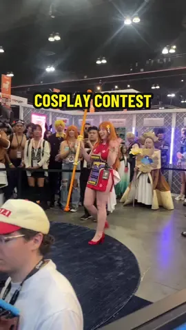 A post by @theanimemen on TikTok caption: ad WE HOSTED THE COOLEST CONTEST AT AX 2025! Check out the @Displate Booth SH10008 this weekend and use code THEANIMEMEN for a discount (not valid on lumino & limited edition) at https://displate.com/@theanimemen #displate  #metalposter #anime 