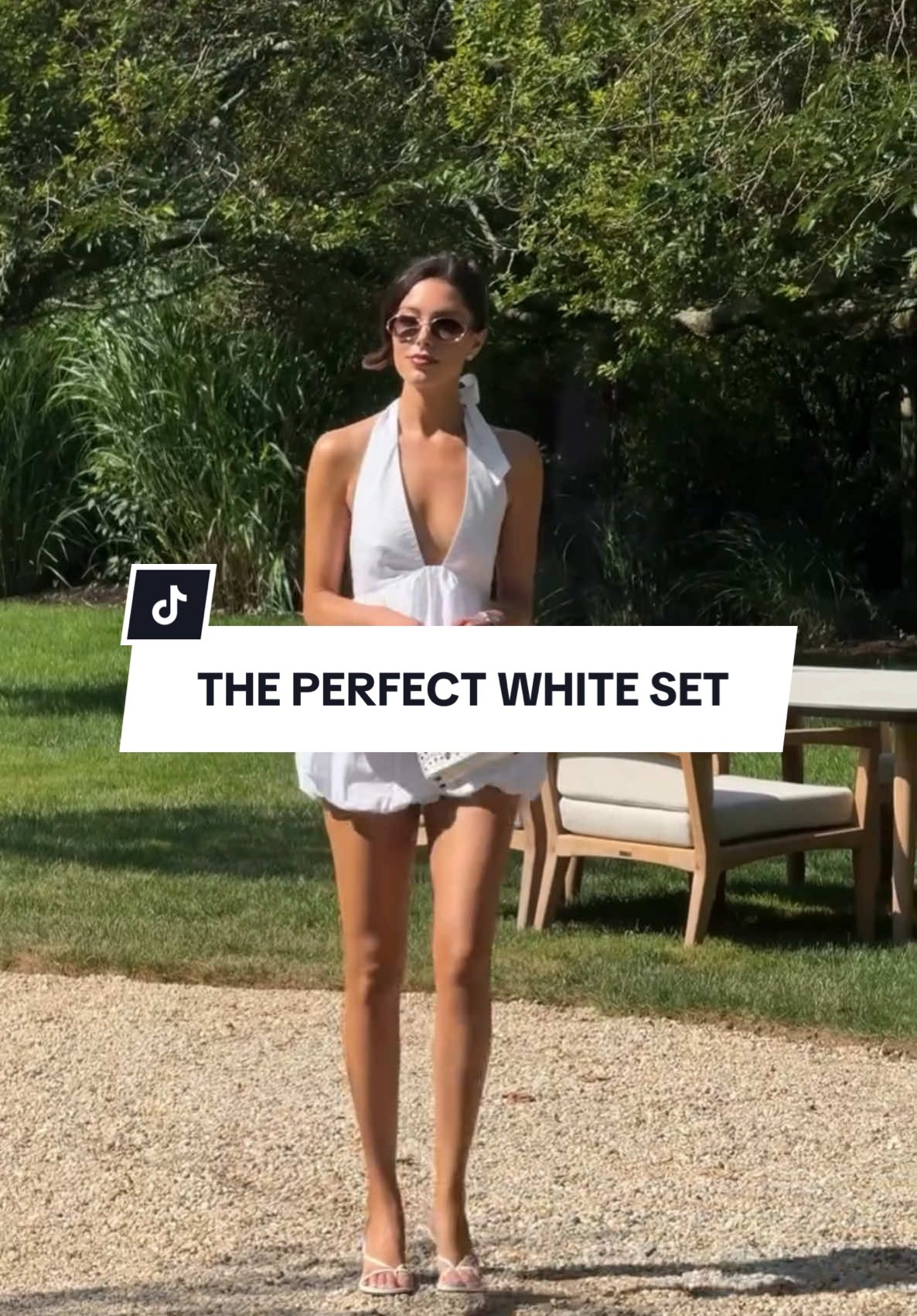 A post by @revolve on TikTok caption: Walking into the weekend like 💃🤍 @jourdansloane in the Lovers and Friends Alina Top + Short 💫  #revolve #revolvesummer #outfitinspo #matchingset #styleinspo #allwhiteoutfit #summerchic #chichstyle #chicoutfitinspo 