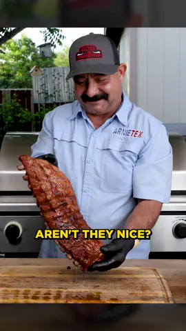 A post by @arnietex on TikTok caption: Taste testing 3 racks of pork ribs (baby backs, full spare and st. louis) all of ‘em grilled AND smoked to perfection 🔥