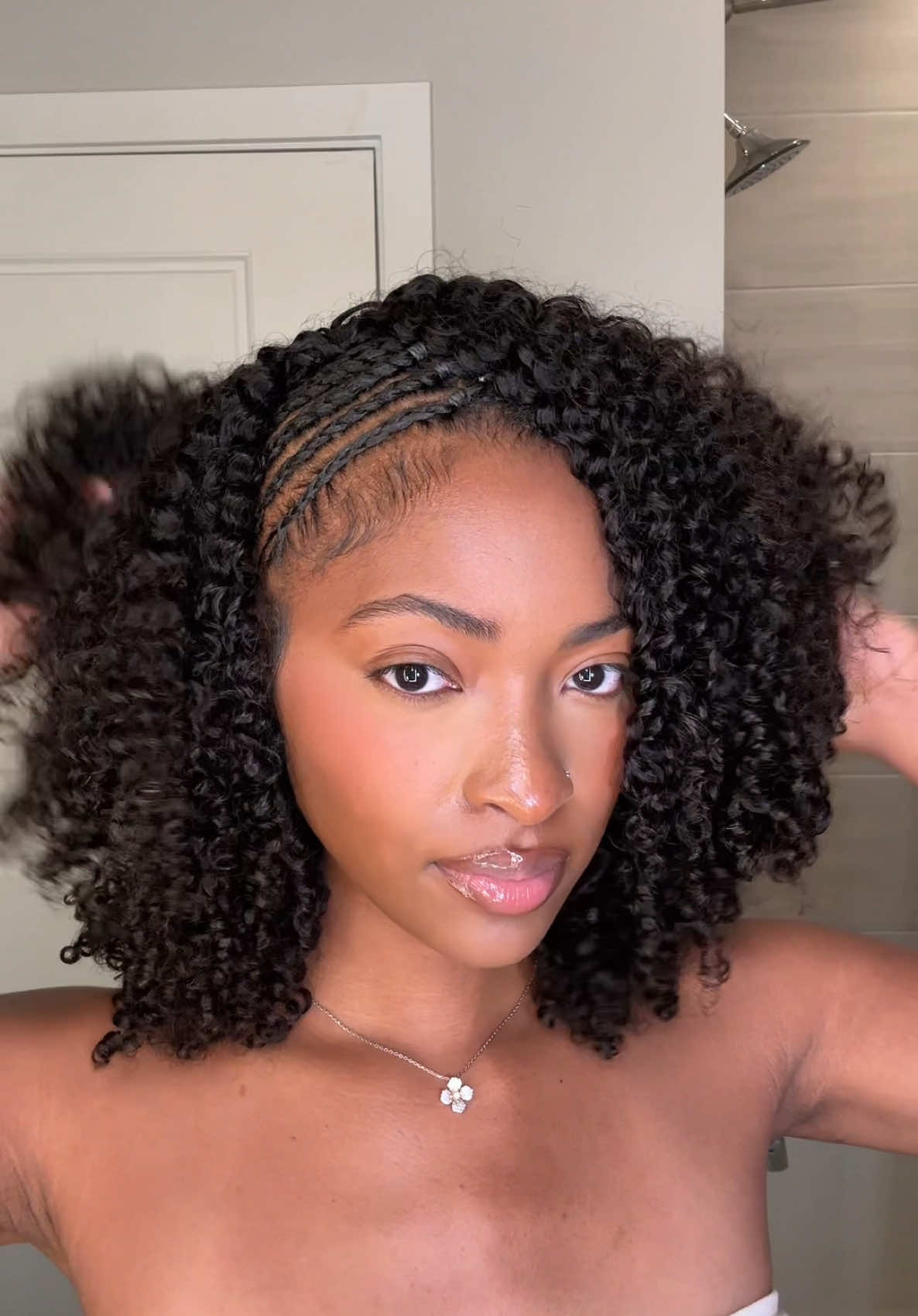 A post by @xoalyria on TikTok caption: This hairstyle is so fun and cute 😊🩷 Half wig from @ISEEHAIR in the texture kinky curly💕 #fyp #halfwig #iseehair #iseehairbeauty #wig #wiginstall #braidstyles #braids 