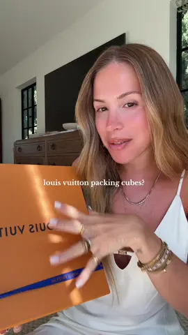 A post by @anastazia on TikTok caption: These packing cubes are so practical and cute! Def prefer them over the toiletry bags #louisvuitton #unboxing 