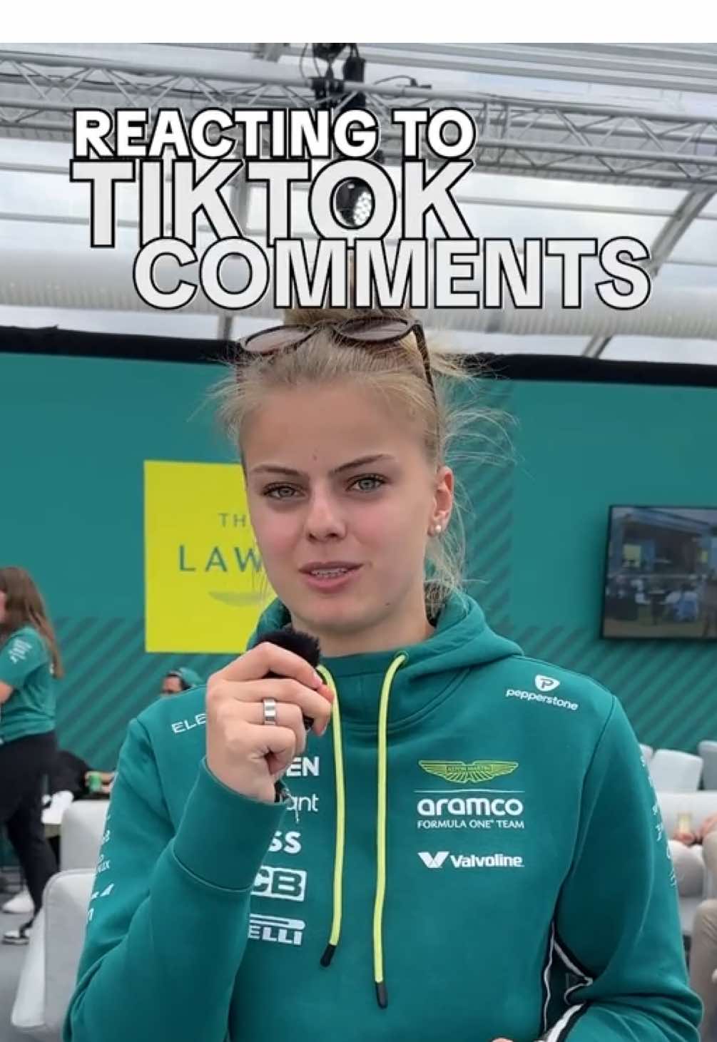 A post by @tiktok_uk on TikTok caption: Tina & Jess reacting to your comments = your serotonin boost for today ✨🏎️ #AstonMartin #F1 #Formula1 #BritishGP #F1TikTok #FanMade 