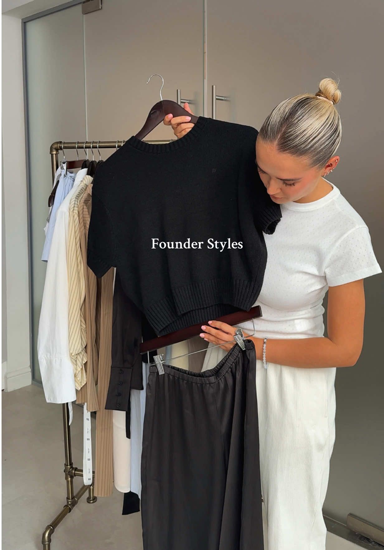 A post by @maebestore on TikTok caption: How Our Founder styles the Mini Pleat Vacation Pants in Black. Paired with the Sofia Knit & Semi Sheer Y Back Vest. 