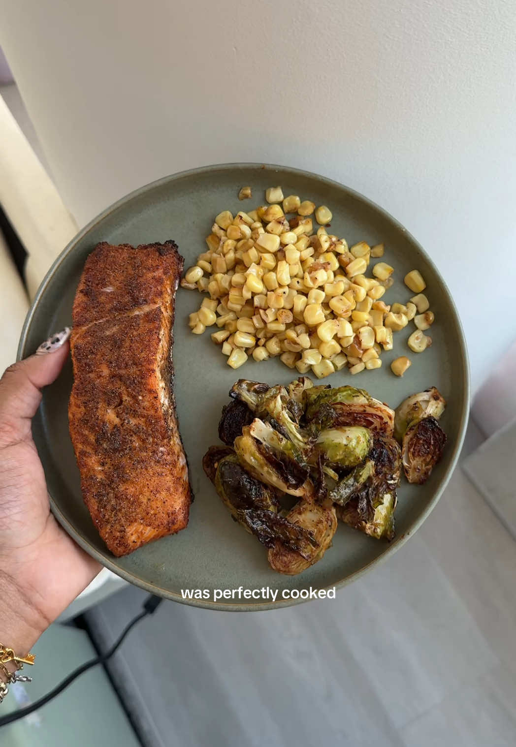 A post by @charismastev on TikTok caption: in my cooking content era I suppose 🙈👩‍🍳🍳 recipe:  salmon:  - generously sprinkle salt, pepper, garlic powder, onion powder, paprika, and creole seasoning or any all purpose seasoning. bake on 400 for 20-25 minutes and broil for 3 minutes for crisp  frozen corn - melt 1.5 tbsp of butter, add frozen corn, add 1 tbsp of oil, stir for 6-8 minutes, add 2 tbsp of heavy cream until milk dissolves, add salt, pepper, and garlic powder until crispy but not burnt (taste to see) (recipe by @TheRealMrsAllen)  brussel sprouts  - check @Jateriya Dashai’ for her recipe!!  #cooking #Ýtưởngchobữatối #easyrecipe 