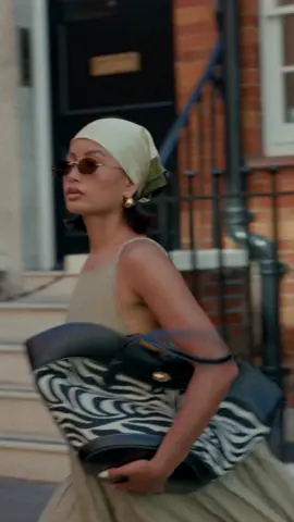 A post by @ on TikTok caption: Summer in the city ✨ @H&M  #summerideas #styleinspo 