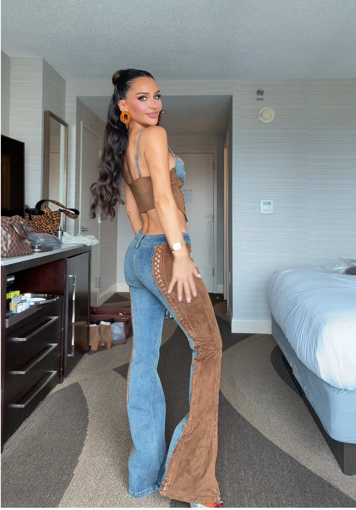 A post by @carlibybel on TikTok caption: Get dressed with me for a #country concert 🤎 #OOTD set is I am Gia, shoes are #jessicasimpson bag is #dior 