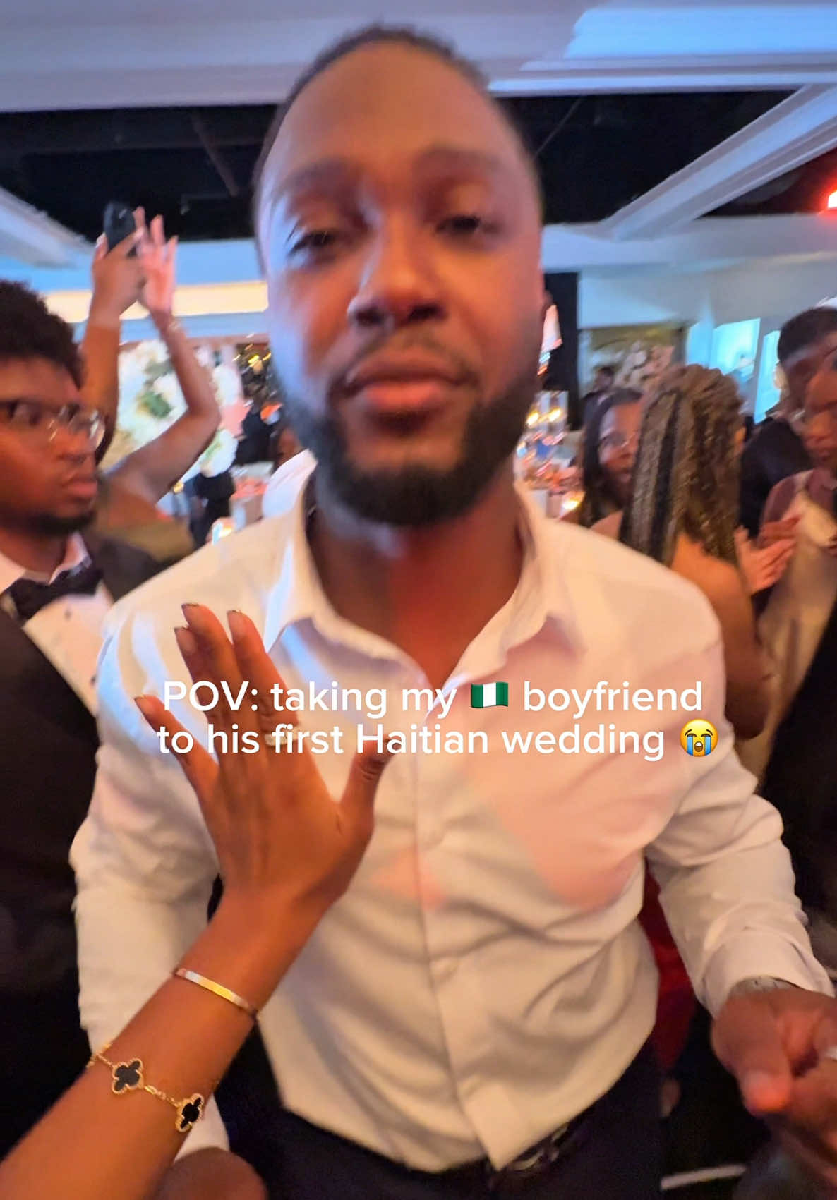 A post by @tajahferjuste on TikTok caption: I think he was just happy to be there 😭  #couple #haitianwedding #nigerian #funny 