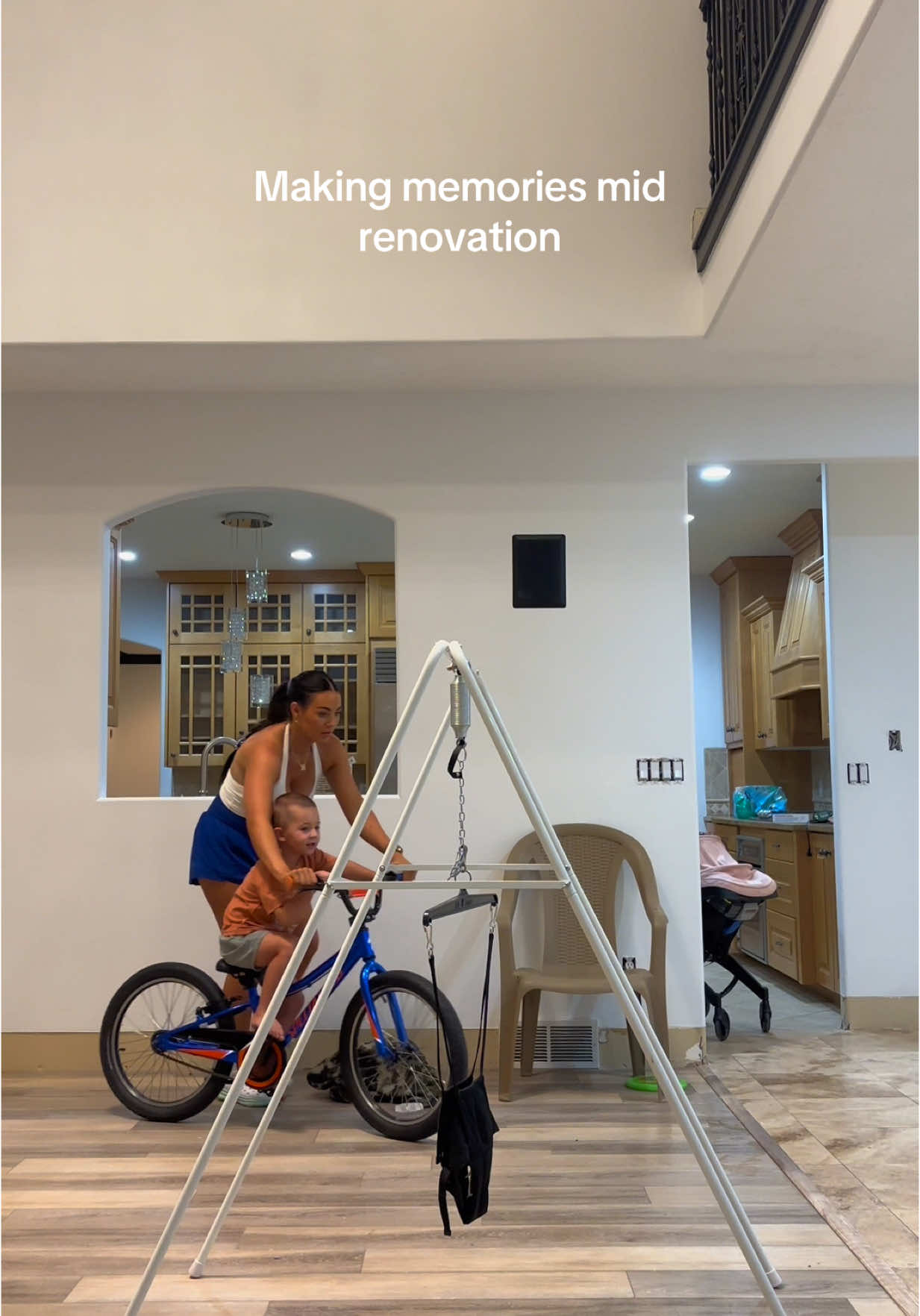 A post by @courtneyycahoon on TikTok caption: Letting him ride his bike inside before it's all replaced 🤪❤️