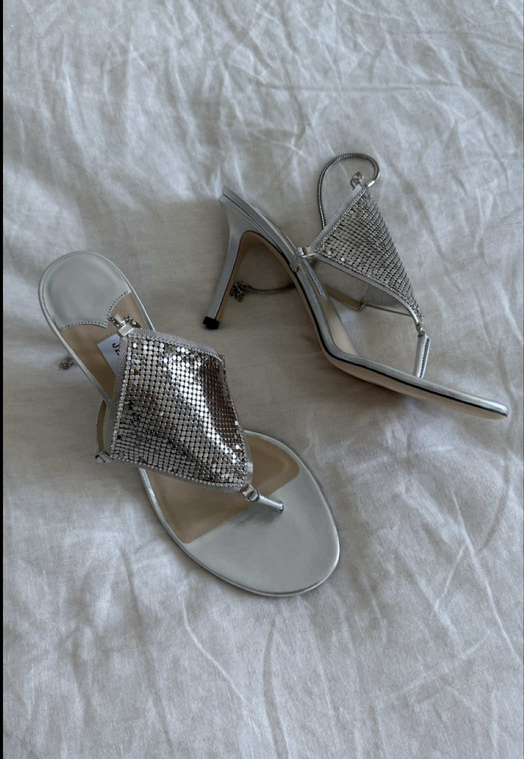 A post by @dzaslavsky on TikTok caption: The perfect ‘Thong’ @Jimmy Choo #jimmychoo #archive #shoeunboxing 