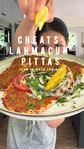 A post by @melizcooks on TikTok caption: Ok, what are you having for dinner tonight, because I really think you should make my Cheats’ Lahmacun Pittas. Even traditionalists like me love a good old cheats’ hack, especially when it’s as good as this! Recipe link to my blog in bio, please make it.  SERVES 4-6 (MAKES 12 PITTA HALVES) Prep: 20 minutes Cook: 10 minutes 4 large, ripe tomatoes 2 large onions, peeled 1 large kapya biber (capia pepper), red romano or red bell pepper, deseeded, roughly chopped green çarliston (charleston) pepper or small green bell pepper, deseeded, roughly chopped 50g/1¾oz fresh flat leaf parsley, roughly chopped 400g (140z) lamb or beef mince 4 large garlic cloves, finely grated 1tsp ground cumin 1½ tsp paprika 1½ tsp pul biber (Aleppo pepper/ Turkish red pepper flakes) 3 tbsp tath biber salças/ (Turkish sweet (mild) red pepper paste) 2 tbsp olive oil 1 tsp fine sea salt 1 tsp coarse black pepper 6 large pitta breads, sliced open into two flat pieces 2 lemons, quartered Pickled peppers, to serve For the salad: 1 large brown onion, peeled and very finely sliced 258 (10z) fresh flat leaf parsley. leaves, roughly chopped 1 tbsp sumac 1 tosp extra virgin olive oil ½ tsp sea salt flakes #lahmacun #pitta #easyrecipe #quickrecipe #salad #melizcooks #recipehack #recipereel #dinner #PleaseMakeIt 