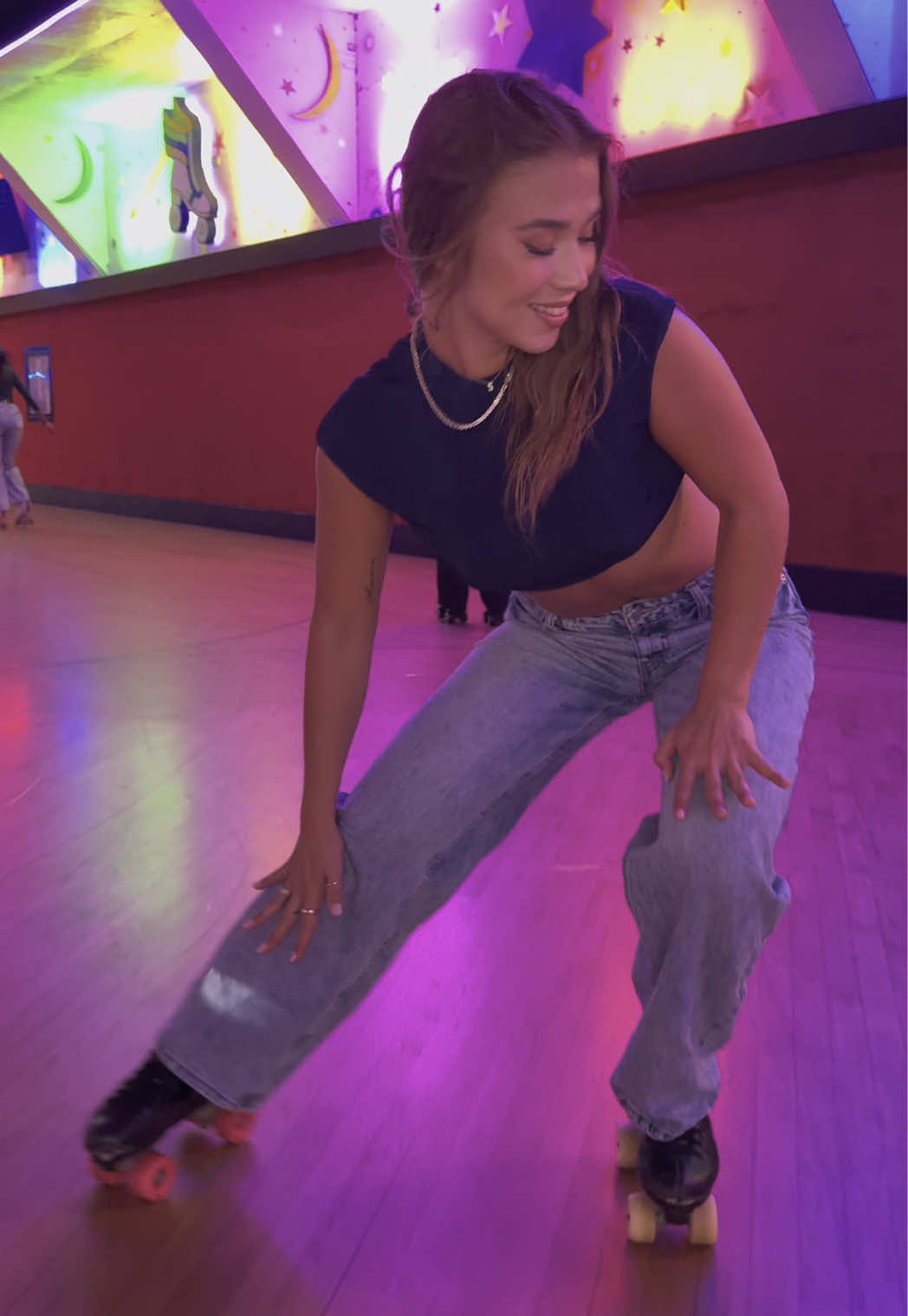 A post by @binnnaaa22 on TikTok caption: Folded 💙 @FashionNova  •Solange Baggy Wide Leg Jeans -medium  •Flora Cropped High Neck Backless Top - Navy #skate #rollerskating #rollerrink #rollerskate #skater #skatergirl #skatelife 
