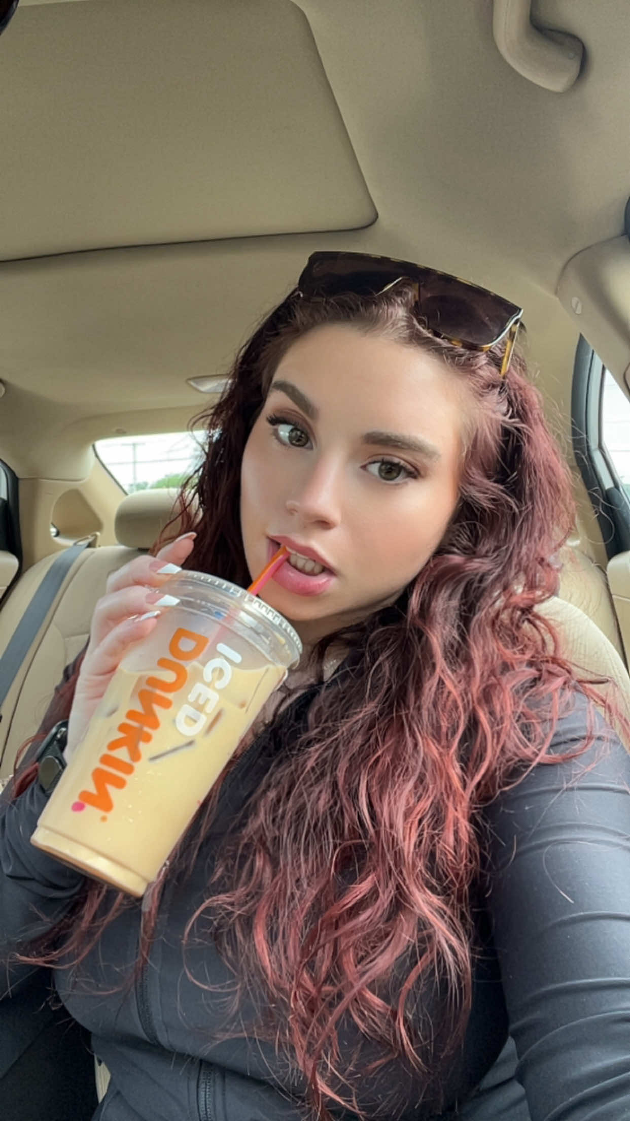 A post by @ on TikTok caption: THE SWEETEST TREAT ☕️ @Dunkin' #cookiedough #icedcoffee #dunkindonuts #newengland #rhodeisland 