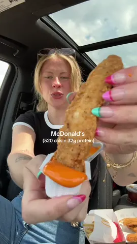 A post by @smallersam_pcos on TikTok caption: McDonald’s Order -255lbs🍔🍟 (520 cals + 32g protein) Here’s how to order: 3 piece McCrispy Strips, KID’S SIZE fry, Diet Coke, and a Spicy Buffalo sauce. **sub sweet and sour sauce for +20 cals if you don’t like buffalo sauce** The hamburger happy meal with apples, fries, and a Diet Coke is (475 cals + 22g protein)  #fastfood #hack #caloriedeficit #protein #real #mom #mealprep #lunch #mcdonalds #chicken #fries #beforeandafter #drivethru 