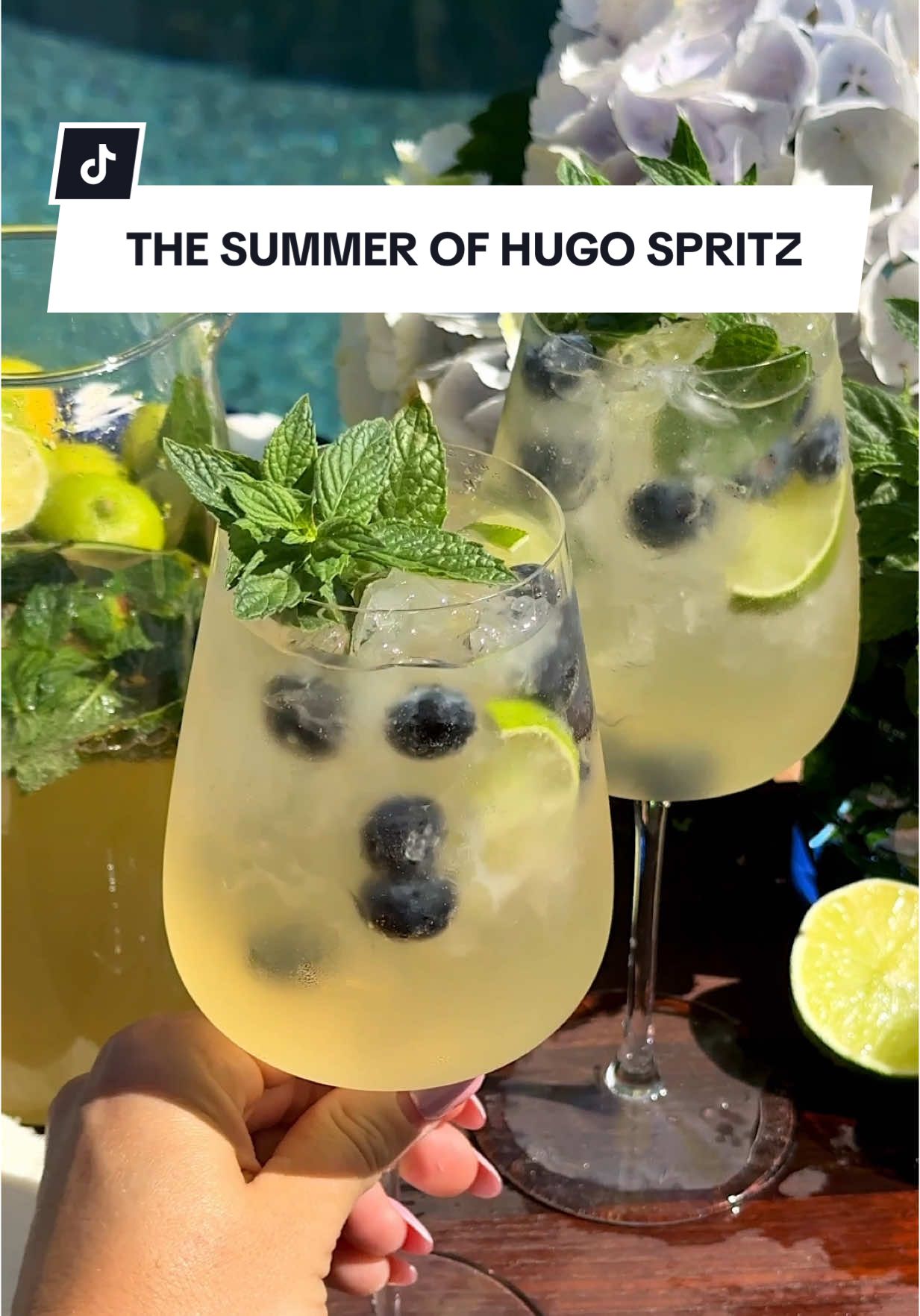 A post by @revolve on TikTok caption: Summer isn't complete without a pitcher of Hugo Spritzes 🍃✨ @join_jules has the perfect cocktail recipe for summer days spent in the sun ☀️ Send this someone who would love it + see the recipe details down below Ingredients 👇 1 bottle Prosecco  9 oz elderflower liqueur 6 oz fresh lime juice 15–20 mint leaves Lime wheels & mint sprigs (garnish) 1–2 oz soda water per glass Optional: Blueberries🫐 Instructions 👇 Clap mint leaves and add to a pitcher. Pour in Prosecco, elderflower liqueur, and lime juice. Stir gently and chill. To serve, pour over ice, top with soda water, and garnish!  #revolve #hugospritz #summeraesthetic #summerrecipes #summerrecipe #summerdrink #drinkofchoice #spritz #FoodTok #EasyRecipe #foryou #fyp 