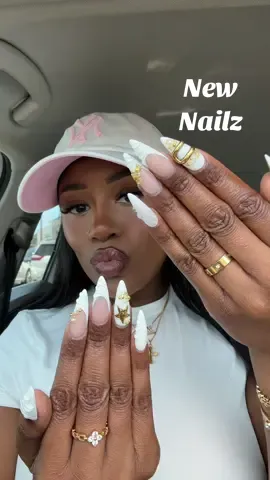 A post by @badbrownskinnn on TikTok caption: New claws ✨ I’m sorry but I thrive in gold and French tips #nailinspo 