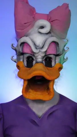 A post by @hollymurraymakeup on TikTok caption: Where’s my Juul?! 😱 FLASH! Daisy Duck inspired makeup! I’m sorry!