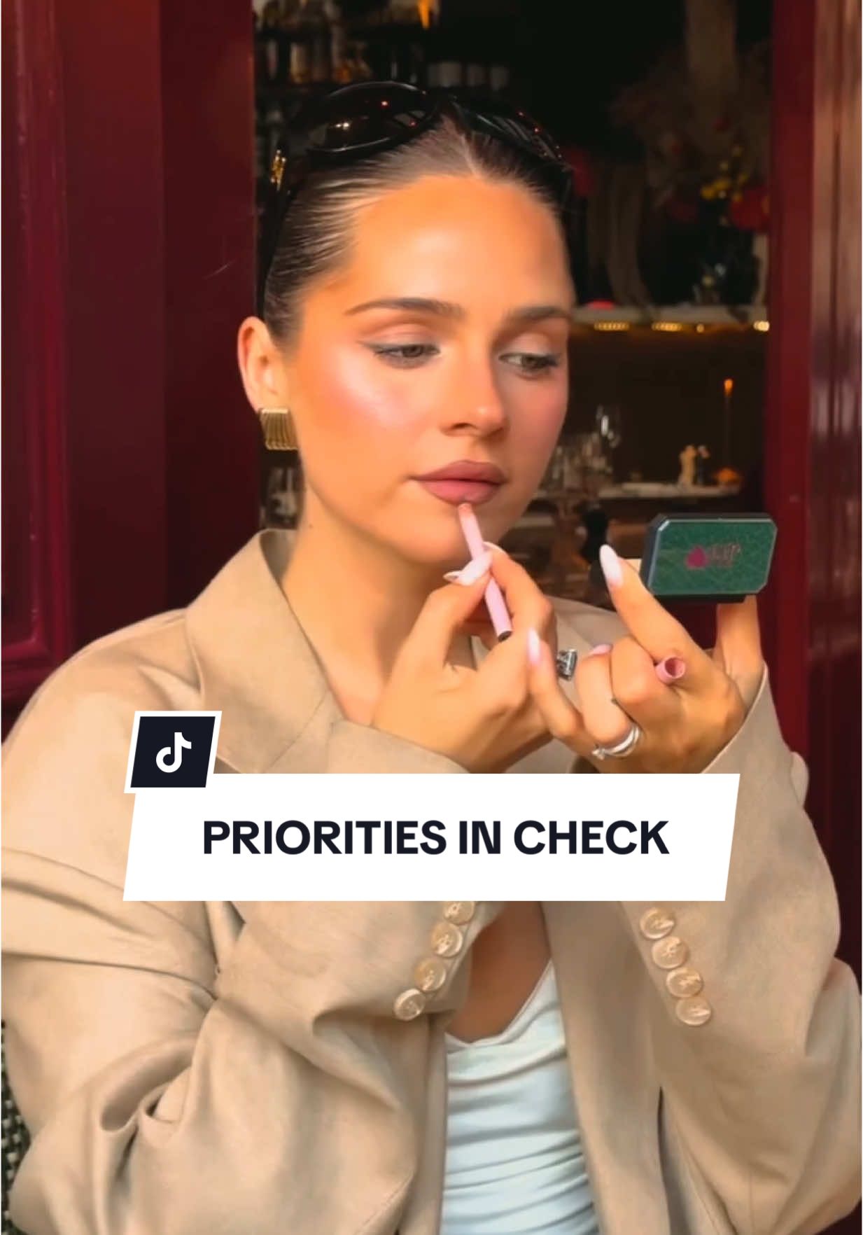 A post by @revolve on TikTok caption: The lip combo comes EVERYWHERE 💄👜  tag the friend that has her priorities straight when it comes to a good gloss moment 🫧💎 @lauraverrwi #revolve #revolvebeauty #lipcombo #prioritiesstraight #thegirlsthatgetit #relatable #justgirlythings #foryou #fyp