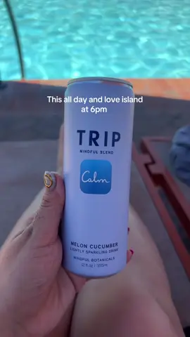 A post by @stephslowsdown on TikTok caption: Pool side and a gummy with my honey #gardening #gardentok #garden #pool #couples #loveislandusa 