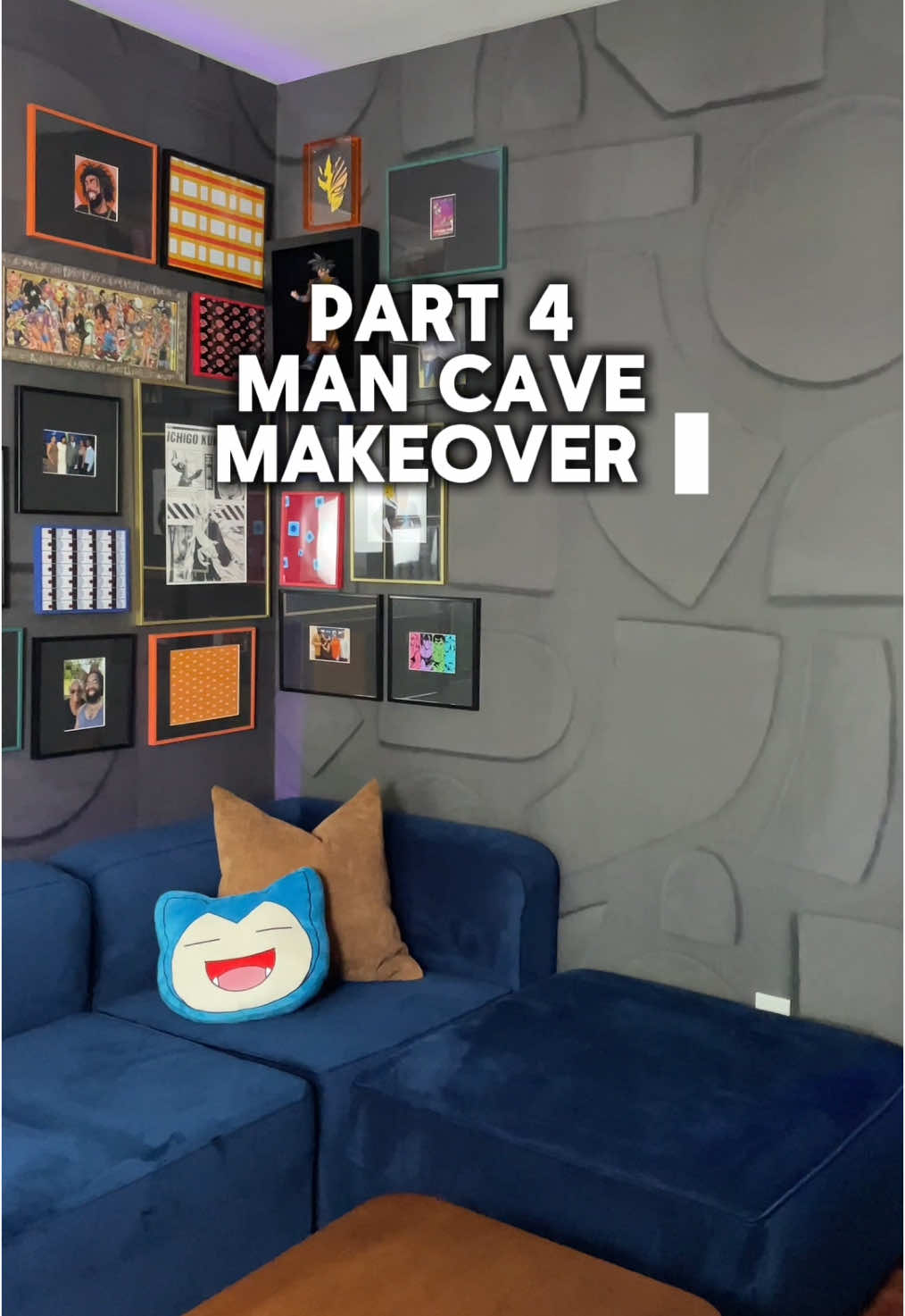 A post by @myuglyapartment on TikTok caption: Replying to @rubyred_1922💙💛  Part 4/4 Which finishing touch is your favorite? Basketball hoop? Shelf behind the sofa? Shelf to display Anime figurines? The indoor basketball hoop is the most fun addition to this man cave. Surprisingly, even though it folds up, we actually keep it out most of the time.  Shop this makeover in my bio: http://bit.ly/3TqR1ZV #ApartmentMakeover #Mancavedecor #apartmentdecor #joybirdsofa #apartmentinspo #cozyapartment #darkandmoodyinteriors #atlantainteriordesigner #masculineinteriors #apartmentdecorideas #masculinehomedecor #gallerywall #animedecor #animegallerywall 