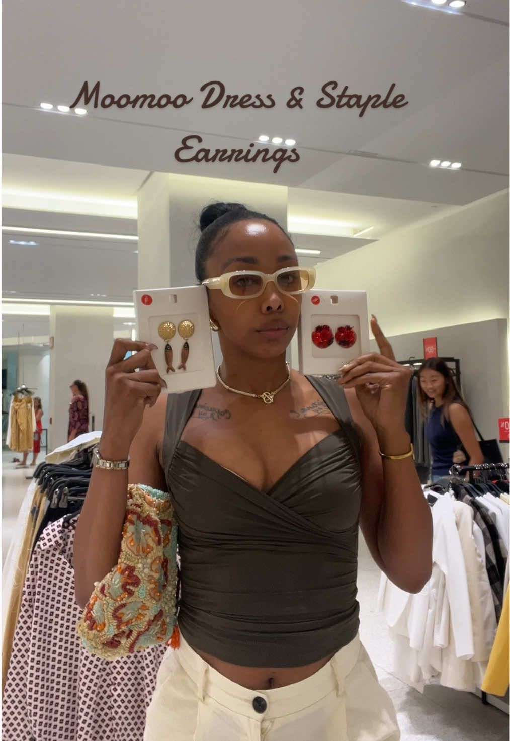 A post by @teamdela on TikTok caption: We bout to find out because I got them 😝🤏🏾 #stapleearrings #moomoodress #amayapapaya 