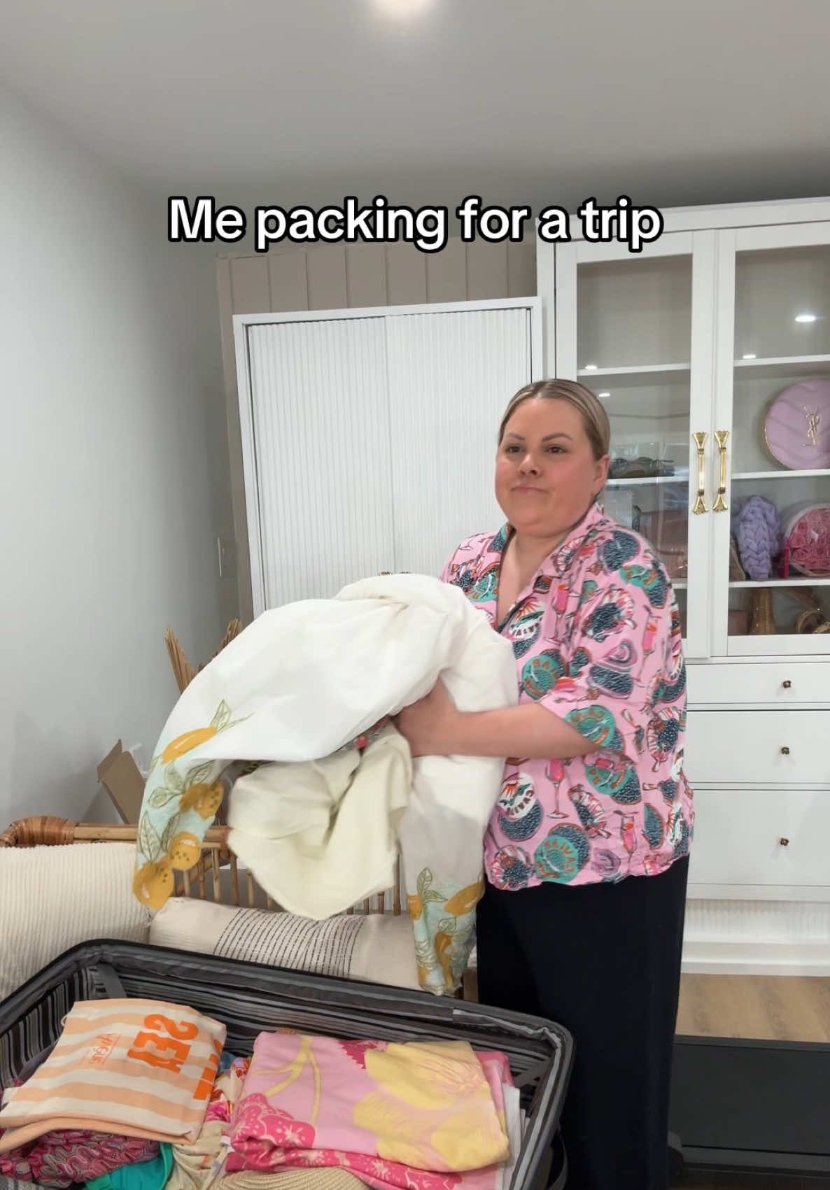 A post by @selenamup on TikTok caption: Me packing for Italy right now… #travel #traveltok #destinationwedding 