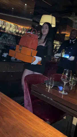 A post by @jenny_montana on TikTok caption: #luxury #miamibeach #dinner #hermes #birkin #experience 🤩🧡🧡 33 thousand dollar drink ❣️#bag 