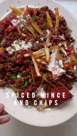 A post by @melizcooks on TikTok caption: Spiced mince, crispy chips, garlic yoghurt and a tomato “sos”, - the recipe is my simple, homemade, full-flavoured cheat’s version of “çökertme kebabı”, full recipe link in bio - please make it.  INGREDIENTS For the chips: 4 tbsp olive oil  750g (1lb 10oz) Cyprus or Maris Piper or King Edward Potatoes 2 tbsp cornflour 1 tsp sea salt flakes For the garlic yoghurt: 150g (5½oz) thick natural yoghurt 1 tsp finely grated garlic A pinch of sea salt flakes, or to taste For the spiced mince: 2 tbsp olive oil 500g (1lb 2oz beef mince 1 tsp finely grated garlic 2 tsp tatl biber salças (Turkish sweet (mild) red pepper paste) 1 tsp pul biber / Aleppo pepper + extra to garnish 1 tsp paprika  1/2 tap sea salt flakes1/2 tap coarse black pepper 10g fresh flat leave parsley leaves, finely chopped For the tomato “sos”: 1 tap olive oil 1 tbsp yatlı biber salçası (Turkish sweet / mild red pepper paste) 200g (7oz) finely chopped tomatoes (tinned or fresh when in season) 1 tsp pul biber / Aleppo pepper  A pinch of sea salt flakes  #melizcooks spiced #mince #crispy #chips #fries #garlic #easydinner #midweekdinner #fakeaway #turkishfood #simpledinner #dinner #melizcooks #fyp 