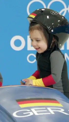 A post by @olympics on TikTok caption: Cutest bobsleigh team ever! 💚 #Olympics #Cute #Sport #OlympicBabies 