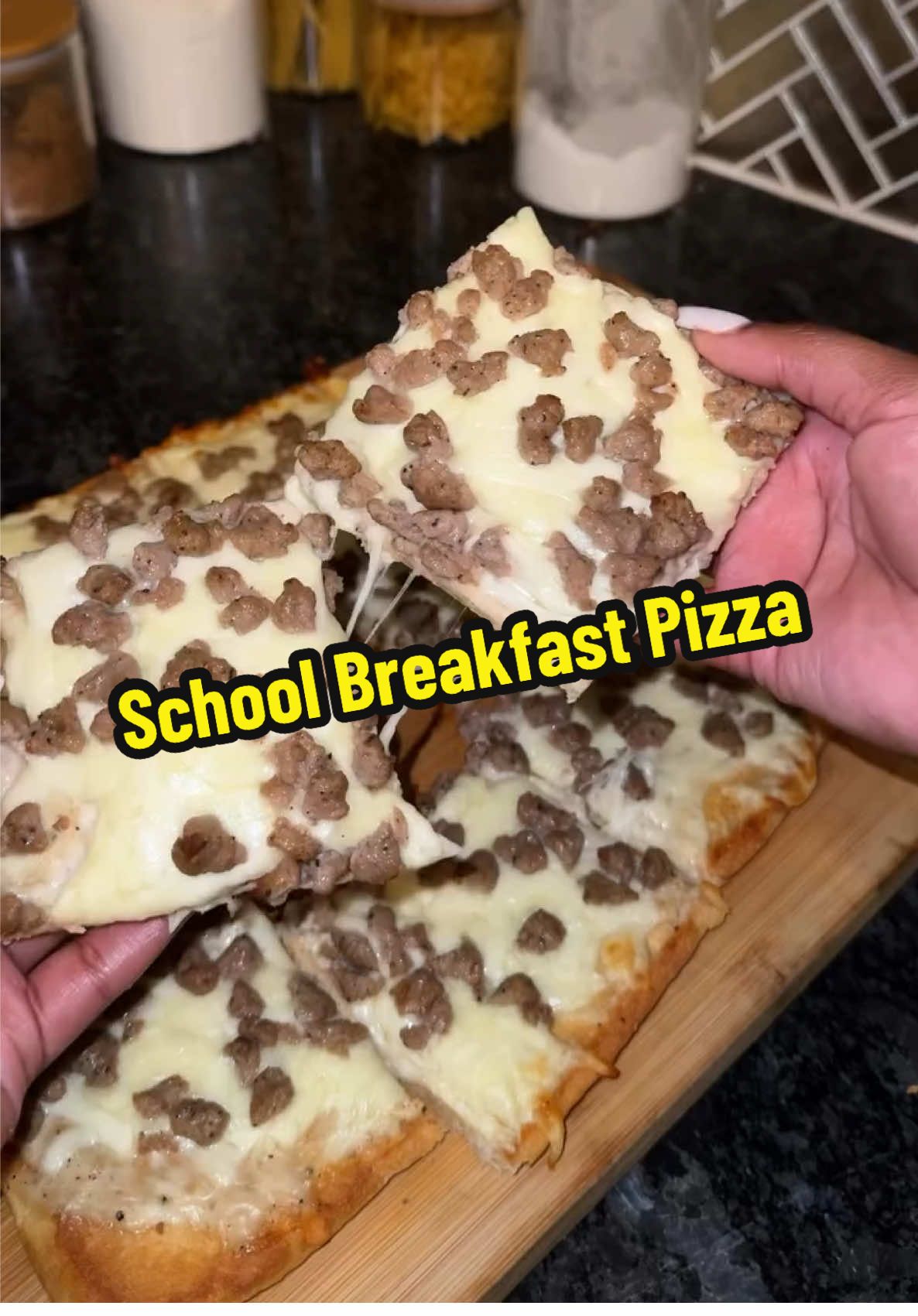 A post by @blackfoodiefinder on TikTok caption: School Breakfast Pizza 🍕 (via @Jateriya Dashai’)  #BlackFoodieFinder #schoolpizza #breakfastpizza #nostalgicfood #nostalgia #loadedpizza #pizzalover #pizzarecipe 