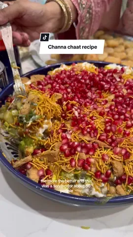 A post by @mywanderinghome on TikTok caption: Replying to @Farha Khan aaand she did it in a saree✨ Channa chaat recipe: 3 tins chickpeas drained  4-5 medium potatoes- peeled, boiled and diced  5 tomatoes deseeded and diced  1 cucumber deseeded and diced  2 small red onions or one large- diced  4-5 green chillies thinly sliced  Large bunch coriander finely chopped  1/4 tsp salt 4-5 tablespoons tamarind sauce  2-3 tablespoons green chilli sauce 2 tbsp chaat masala  3-4 pieces crushed Nimki  Approx 6-8 tablespoons natural yoghurt  1/4 packet aloo bhujia  Seeds of 2 pomegranates Mix together all of the vegetables, herbs, chilli & salt. Stir in the chaat masala, green chilli chutney and tamarind sauce. Top with the crushed Nimki, add a layer of yoghurt, some extra sauce.  Sprinkle over a generous layer of aloo bhujia then garnish with pomegranate and coriander 